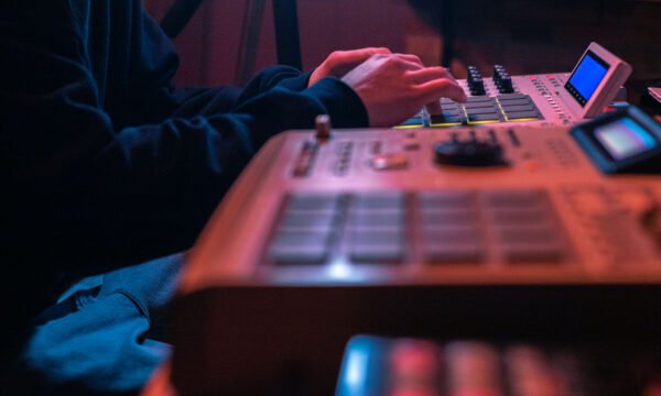 The hands of an artist creating music with his drum machines und The hands of an artist creating music with his drum machines und